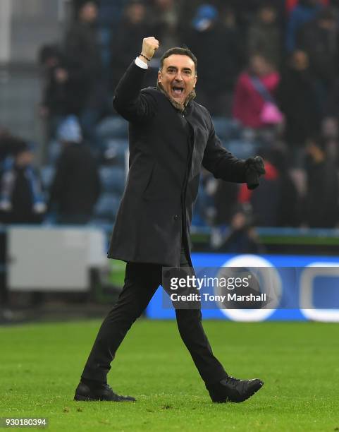 Carlos Carvalhal, Manager of Swansea City celebrates at the end of the Premier League match between Huddersfield Town and Swansea City at John...