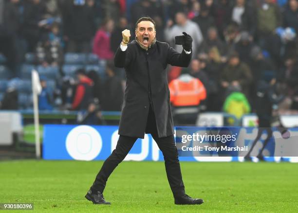 Carlos Carvalhal, Manager of Swansea City celebrates at the end of the Premier League match between Huddersfield Town and Swansea City at John...