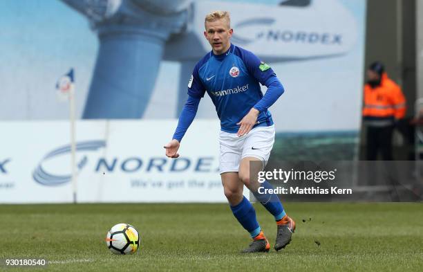 Bryan Henning of Rostock runs with the ball during the 3.Liga match between FC Hansa Rostock and SC Paderborn 07 at Ostseestadion on March 10, 2018...