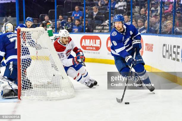 Tampa Bay Lightning defender Anton Stralman circles his goal as Montreal Canadiens right wing Andrew Shaw chases during the third or overtime period...