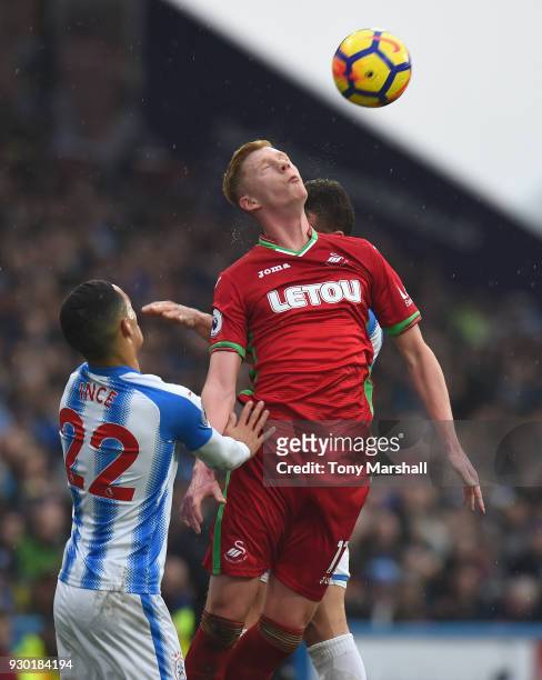 Sam Clucas of Swansea City wins the ball in the air during the Premier League match between Huddersfield Town and Swansea City at John Smith's...