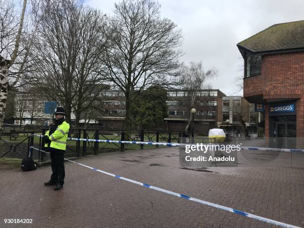 Police officials take security measures around a restaurant, a bar and the bench that former Russian spy Sergei Skripal and his daughter were found...