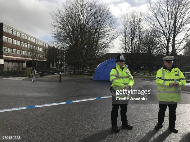 Security forces cordon off the former Russian spy Sergei Skripal's vehicle, home and the ambulance carrying him and his daughter after they were...