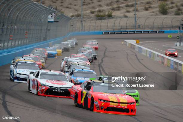 Justin Allgaier, driver of the BRANDT Professional Agriculture Chevrolet, leads the field past the green flag to start the NASCAR Xfinity Series DC...