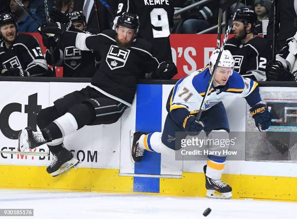 Vladimir Sobotka of the St. Louis Blues misses a check from Jake Muzzin of the Los Angeles Kings during the first period at Staples Center on March...