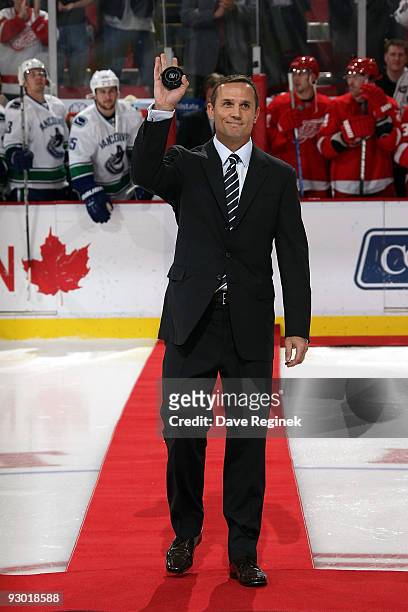 Steve Yzerman walks down the carpet, prior to his official pre-game puck drop ceremony in honor of his induction into the Hockey Hall of Fame which...