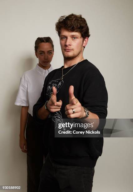 Actors Hayley Law and Brett Dier from the film "The New Romantic" pose for a portrait in the Getty Images Portrait Studio Powered by Pizza Hut at the...