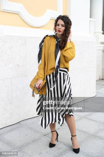 Fashion Student Margarida Sousa wearing skirt, scarf and sweater from Stradivarius, bag from Zara during the 50 edition of Lisboa Fashion Week...