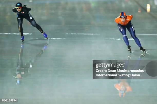 Miho Takagi of Japan and Ireen Wust of the Netherlands compete in the 5000m Ladies race during the World Allround Speed Skating Championships at the...