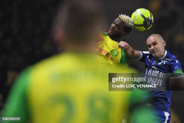 Troyes' French midfielder Benjamin Nivet vies with Nantes' Nigerian defender Chidozie Awaziem during the French L1 football match between Nantes and...