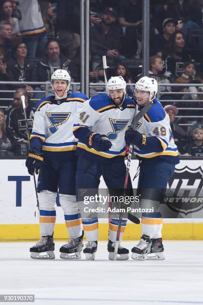 Carl Gunnarsson, Robert Bortuzzo, and Ivan Barbashev of the St. Louis Blues celebrate after scoring a goal against the Los Angeles Kings at STAPLES...