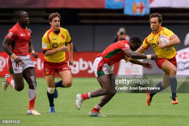 Pablo Fontes of Spain pushes away Nelson Oyoo of Kenya during day 1 of the 2018 Canada Sevens Rugby Tournament on March 10, 2018 at BC Place in...