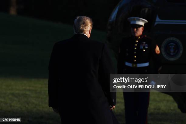 President Donald Trump walks towards Marine One as he departs the White House in Washington, DC on March 10, 2018. President Trump is travelling to...