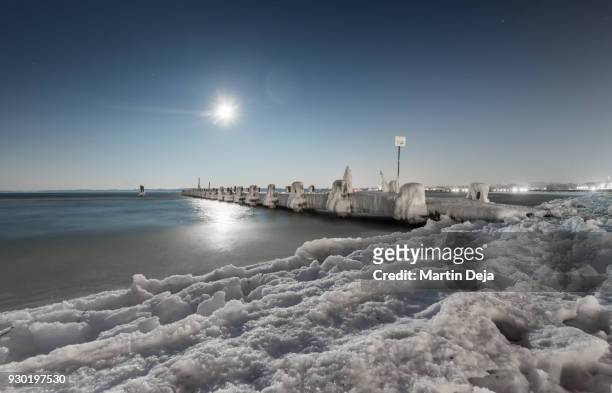 lübeck travemünde frozen jetty in winter at night - travemünde stock pictures, royalty-free photos & images