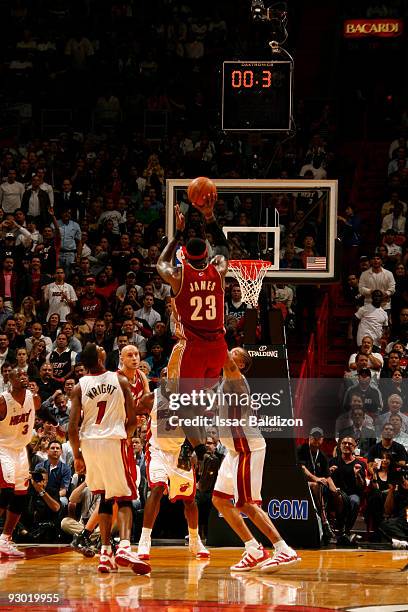 LeBron James of the Cleveland Cavaliers shoots against the Miami Heat on November 12, 2009 at American Airlines Arena in Miami, Florida. NOTE TO...