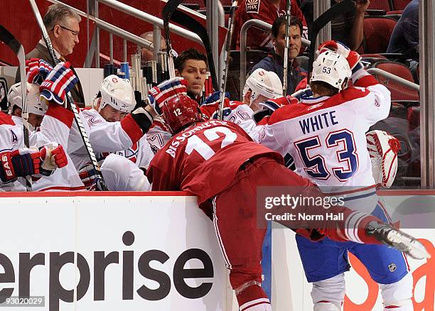 Paul Bissonnette of the Phoenix Coyotes checks Ryan White of the Montreal Canadiens on November 12, 2009 at Jobing.com Arena in Glendale, Arizona.