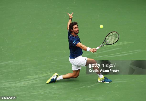 Pablo Cuevas of Uruguay hits a backhand during his match against Denis Shapovalov of Canada during the BNP Paribas Open at the Indian Wells Tennis...