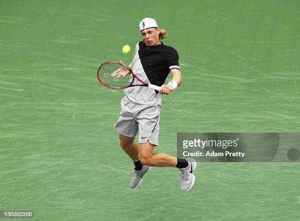 Denis Shapovalov of Canada hits a backhand during his match against Pablo Cuevas of Uruguay during the BNP Paribas Open at the Indian Wells Tennis...