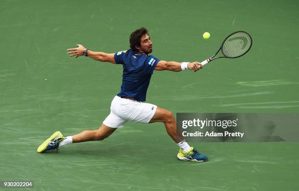 Pablo Cuevas of Uruguay hits a backhand during his match against Denis Shapovalov of Canada during the BNP Paribas Open at the Indian Wells Tennis...