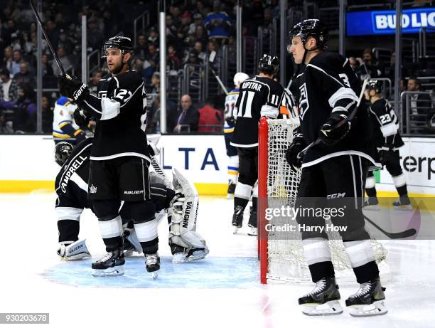 Alec Martinez and Dion Phaneuf of the Los Angeles Kings react after a goal from Kyle Brodziak of the St. Louis Blues for a 6-1 Blues lead during the...