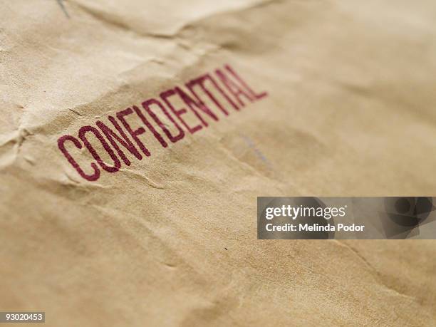 confidential stamped on an envelope or package - brown envelope stock pictures, royalty-free photos & images