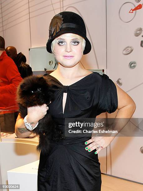 Dancing with the Stars' Kelly Osbourne and her new Pomeranian dog, Sid attend the Swatch Brand re-launch at the Swatch Store Times Square on November...