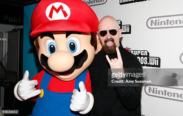 Mario and Judas Priest's Rob Halford attends the 25 years of Mario celebration at the Nintendo World Store on November 12, 2009 in New York City.