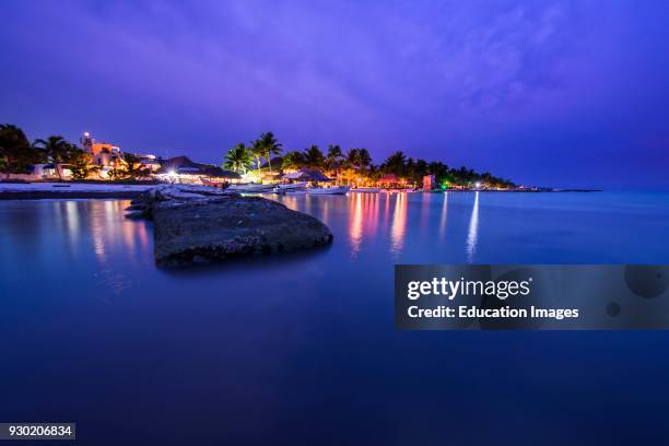 Dock in a beach of Isla Holbox at sunset, Quintana Roo, Mexico.