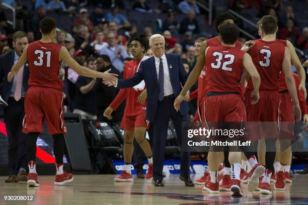 Head coach Bob McKillop of the Davidson Wildcats celebrates with Kellan Grady, Rusty Reigel, and Jon Axel Gudmundsson in the Semifinals of the...