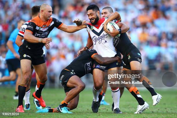 Isaac Liu of the Roosters is tackled during the round one NRL match between the Wests Tigers and the Sydney Roosters at ANZ Stadium on March 10, 2018...