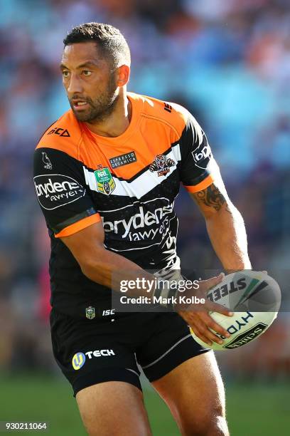 Benji Marshall of the Tigers shapes to pass during the round one NRL match between the Wests Tigers and the Sydney Roosters at ANZ Stadium on March...