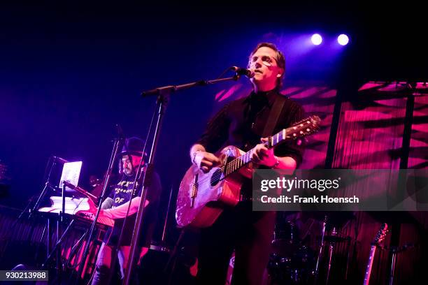 Singer Joey Burns of the American band Calexico performs live on stage during a concert at the Tempodrom on March 10, 2018 in Berlin, Germany.