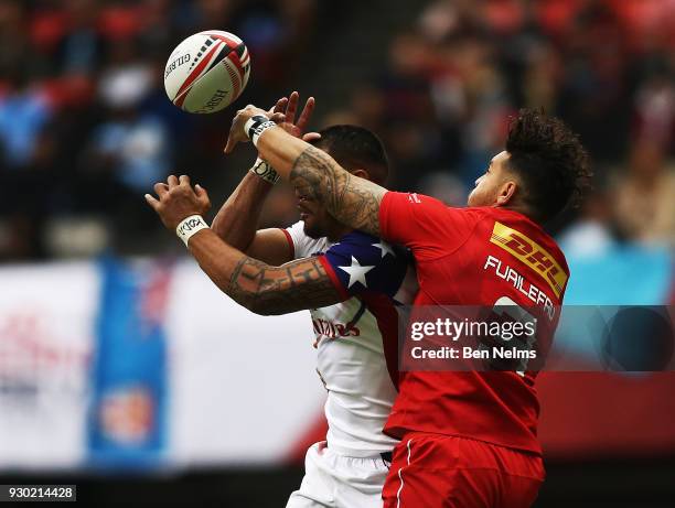 Mike Fuailefau of Canada fights for the ball against Martin Iosefo of the United States during the Canada Sevens, the Sixth round of the HSBC Sevens...