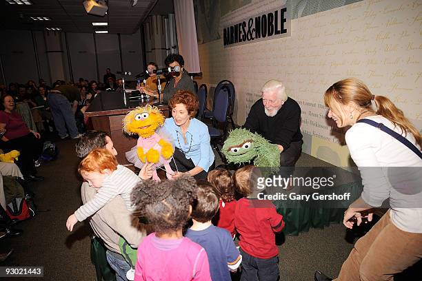 Puppeteers Fran Brill with "Sesame Street" puppet Zoe and Caroll Spinney with Oscar the Grouch entertain children at Sesame Street: A Celebration of...