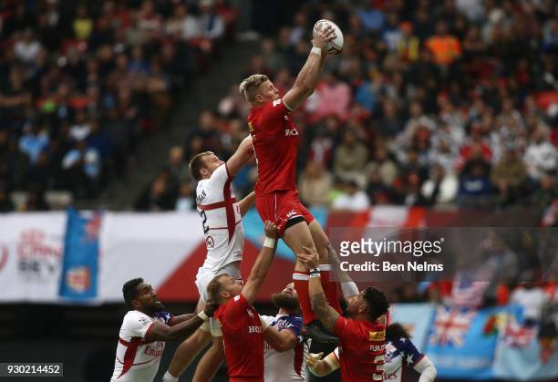 John Moonlight of Canada catches the ball near Ben Pinkelman of the United States during the Canada Sevens, the Sixth round of the HSBC Sevens World...