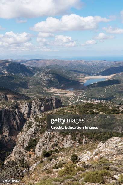 View across mountains of a water reservoir from the mountain road at Ano Kera, Lasithi, Crete, Greece.