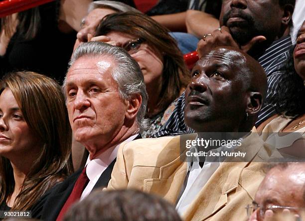 Pat Riley, President of Basketball Operations of the Miami Heat sits with Hall of famer Michael Jordan on November 12, 2009 at American Airlines...