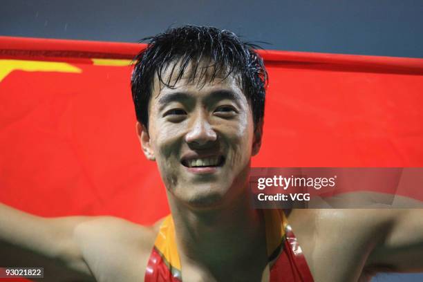 Liu Xiang of China celebrates after the men's 110m hurdles of 18th Asian Athletics Championships at Guangzhou Olympic Sports Center on November 12,...