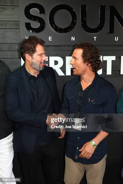 Guy Oseary and Matthew McConaughey shake hands during the the Sound Ventures Tech Competition, PerfectPitch, at SXSW at Hotel Van Zandt on March 10,...