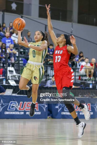 Blazers guard Miyah Barnes throws up a shot at the end of the 3rd quarter with Western Kentucky Lady Toppers forward Tashia Brown defending during...