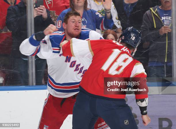 Cody McLeod of the New York Rangers and Micheal Haley of the Florida Panthers fight during first period action at the BB&T Center on March 10, 2018...