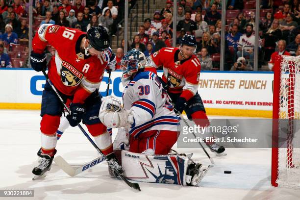 Jonathan Huberdeau of the Florida Panthers shoots and scores against Goaltender Henrik Lundqvist of the New York Rangers at the BB&T Center on March...