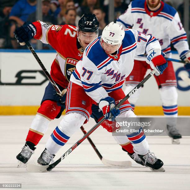 Tony DeAngelo of the New York Rangers tangles with Frank Vatrano of the Florida Panthers at the BB&T Center on March 10, 2018 in Sunrise, Florida.