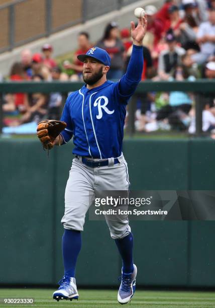Kansas City Royals right fielder Tyler Collins tosses the ball to the pitchers mound during the MLB Spring Training baseball game between the Kansas...