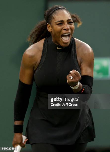 Serena Williams reacts after winning a point against Kiki Bertens of the Netherlands during the BNP Paribas Open on March 10, 2018 at the Indian...