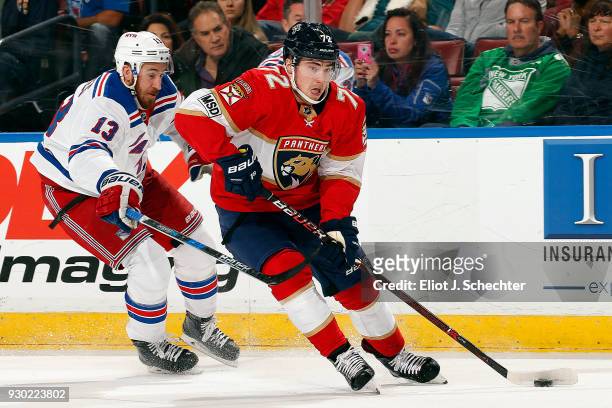 Frank Vatrano of the Florida Panthers skates with the puck against Kevin Hayes of the New York Rangers at the BB&T Center on March 10, 2018 in...