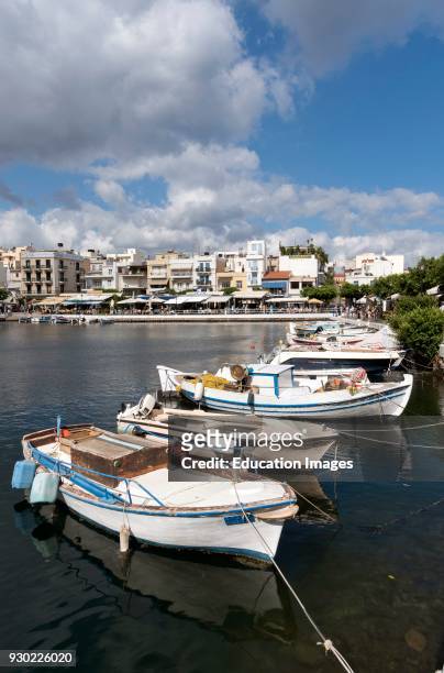 Agios Nikolaos, Crete, Greece. Small fishing boats on the Lake which is said to be bottomless.