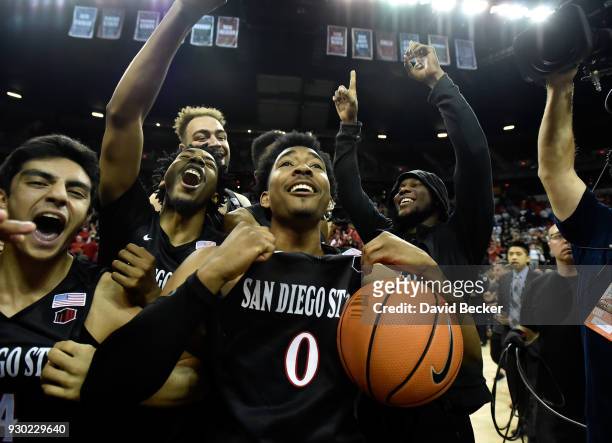 Devin Watson of the San Diego State Aztecs celebrates with teammates the victory over the New Mexico Lobos after the championship game of the...