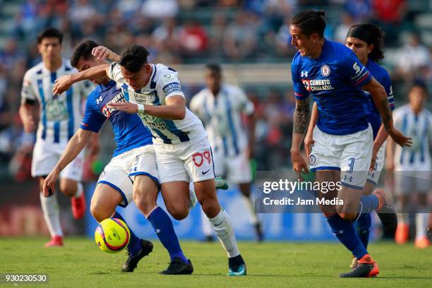 Francisco Silva , Enzo Roco of Cruz Azul and Angelo Sagal of Pachuca fight for the ball during the 11th round match between Cruz Azul and Pachuca as...