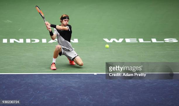 Andrey Rublev of Russia hits a backhand during his match against Taylor Fritz of the USA during the BNP Paribas Open at the Indian Wells Tennis...